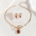 Gold Inlaid White Rhinestone Brown Crystal Necklace and Earrings Suite for Women V-Shaped Alloy Pendant with Fishtail and Fan-Shaped Elements Exaggerated Style