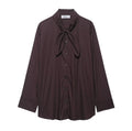 Brown women's loose-fit poplin shirt with long sleeves, cardigan style, and a bow tie detail.