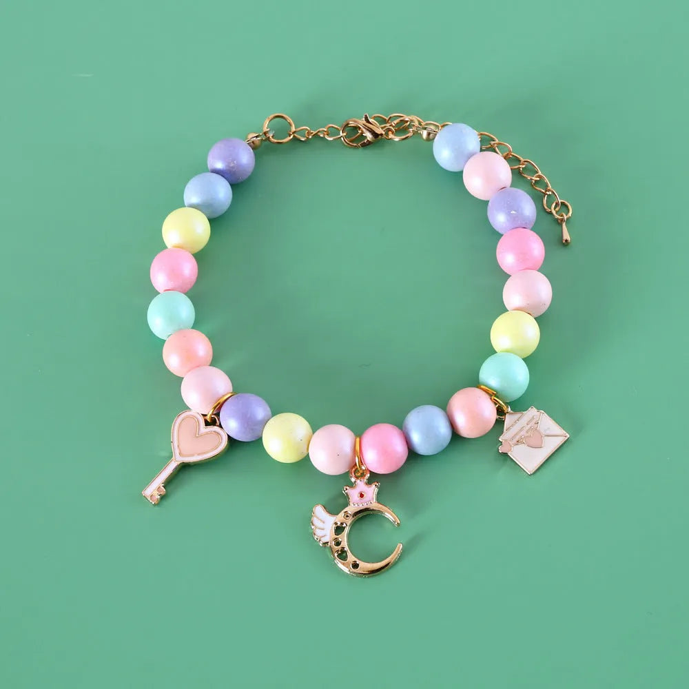 Pastel macaron charm pet collar with moon and rabbit designs on adjustable resin band for cats and dogs