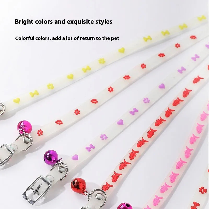 Luminous adjustable cat collar with bell in silicone and metal, showing paw print design for night visibility.