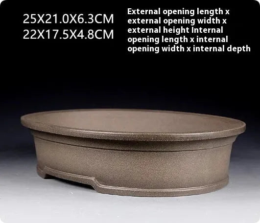 Handmade antique oval bonsai flower pot in purple sand for succulent plants.