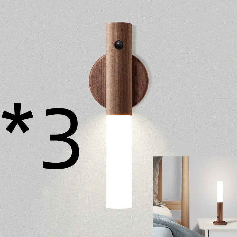 Smart sensor LED desk lamp with solid wood base and clear acrylic shade on a wooden table.