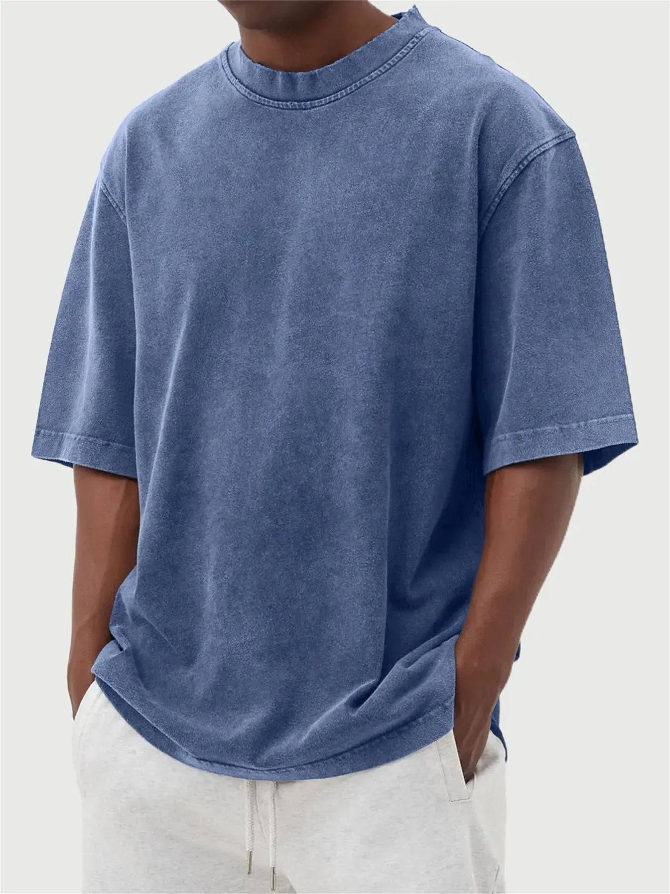Men's distressed stone wash pullover T-shirt in loose fit with half sleeves available in multiple solid colours