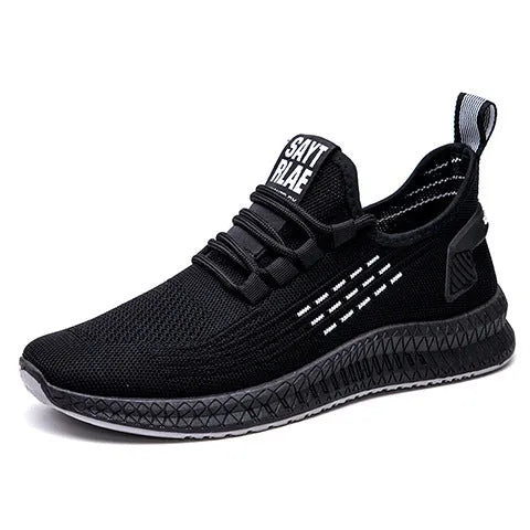 Men's black casual low-top trainers with flying weave upper, cross straps, and a striped pattern.