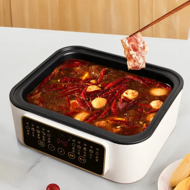 Stainless steel household electric steamer appliance with visible steaming rack and control panel.