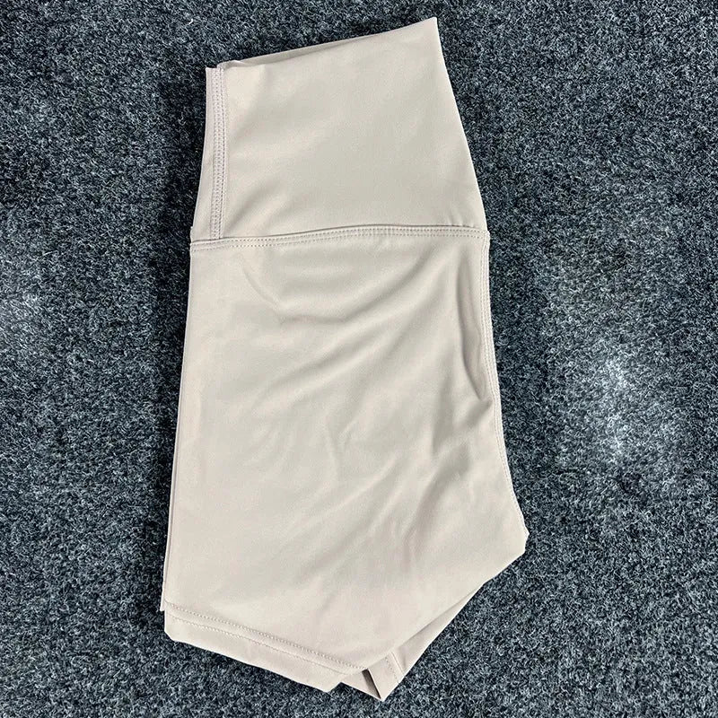 Ladies high-waisted yoga shorts in nylon fabric, shown in one of 16 available colours.