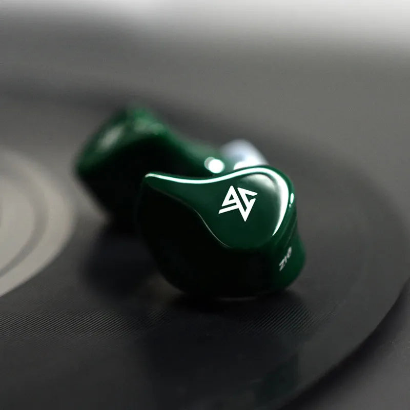 Black and Green Z1 true wireless Bluetooth in-ear earbuds with charging case.