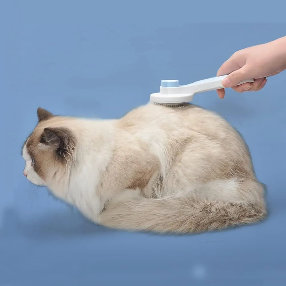 Blue self-cleaning cat brush with rubber handle and metal pins for pet grooming.