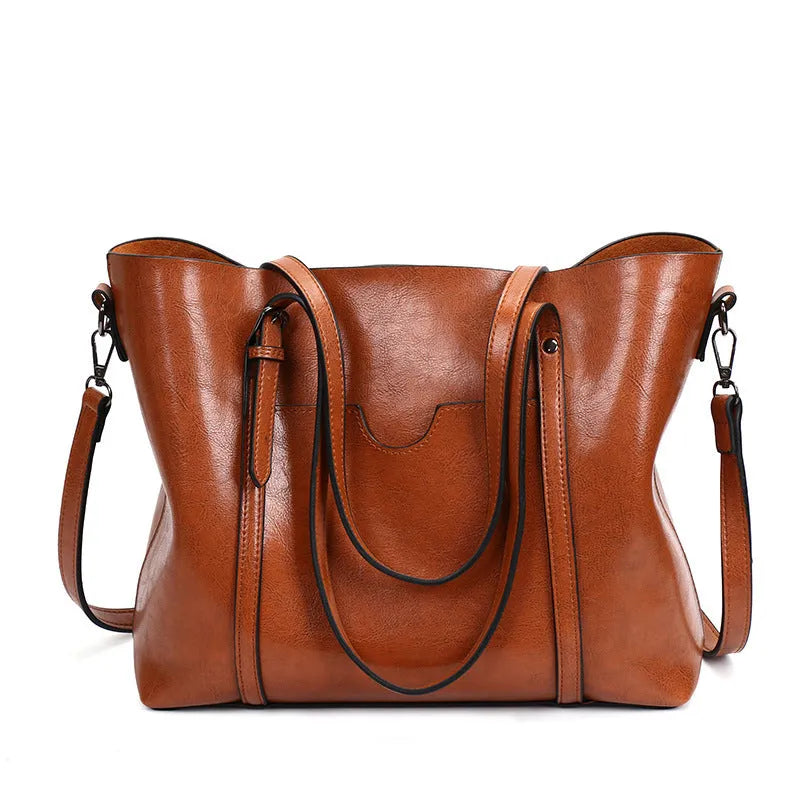 Retro messenger bag for women showing coffee colour option with A4 magazine for scale