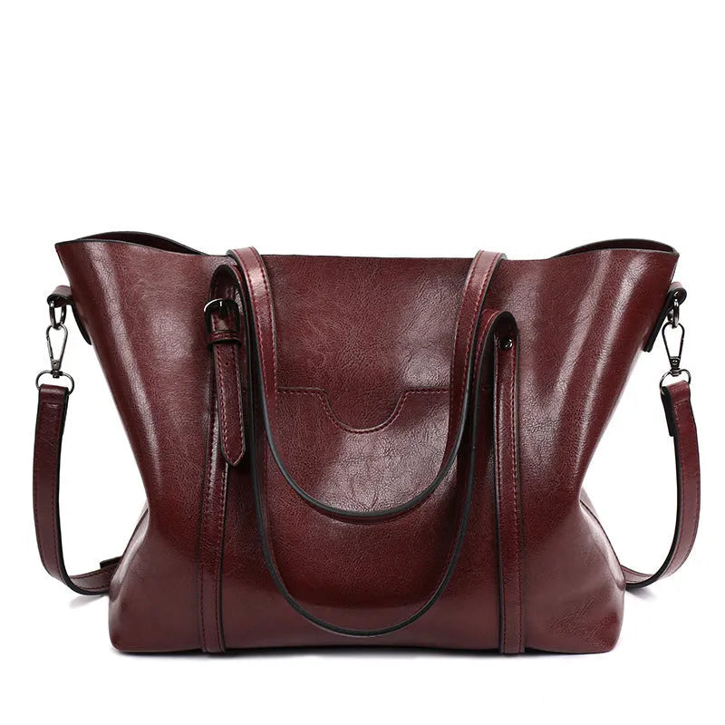 Retro messenger bag for women showing coffee colour option with A4 magazine for scale