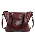 Retro messenger bag for women showing coffee colour option with A4 magazine for scale