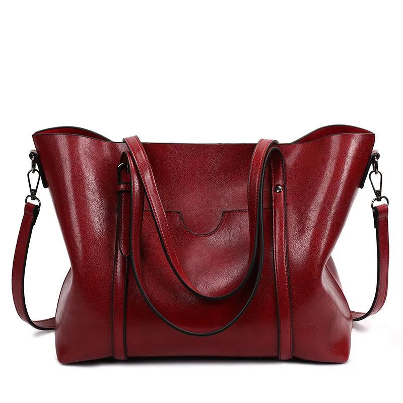 Retro messenger bag for women showing coffee colour option with A4 magazine for scale