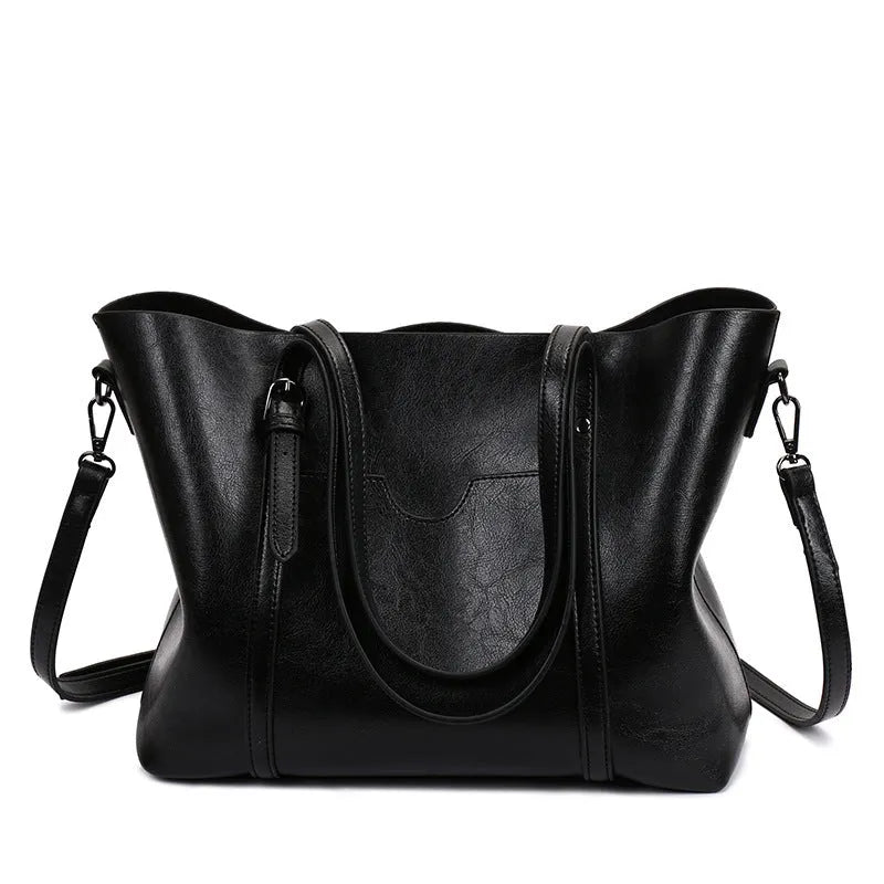 Retro messenger bag for women showing coffee colour option with A4 magazine for scale