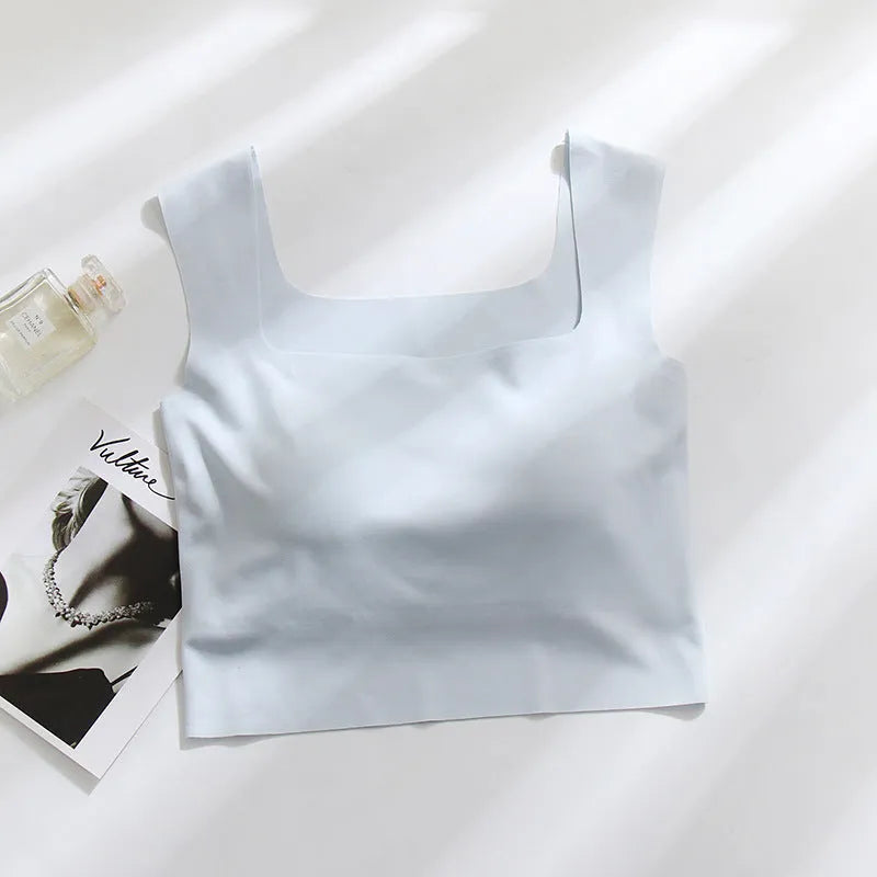 Women's non-marking nylon sling vest with chest pad in light blue, shown from the back.