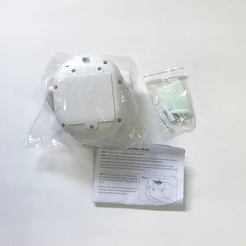 White Atomic Angel induction lamp made of ABS plastic on a plain background