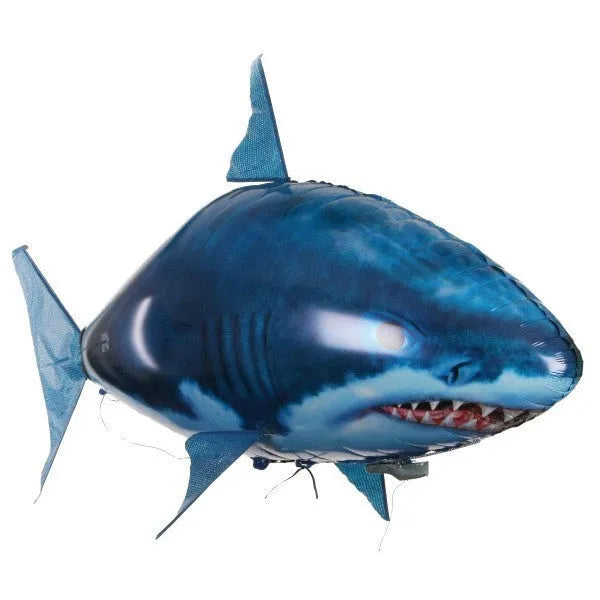 Large remote control inflatable shark balloon floating indoors with remote.