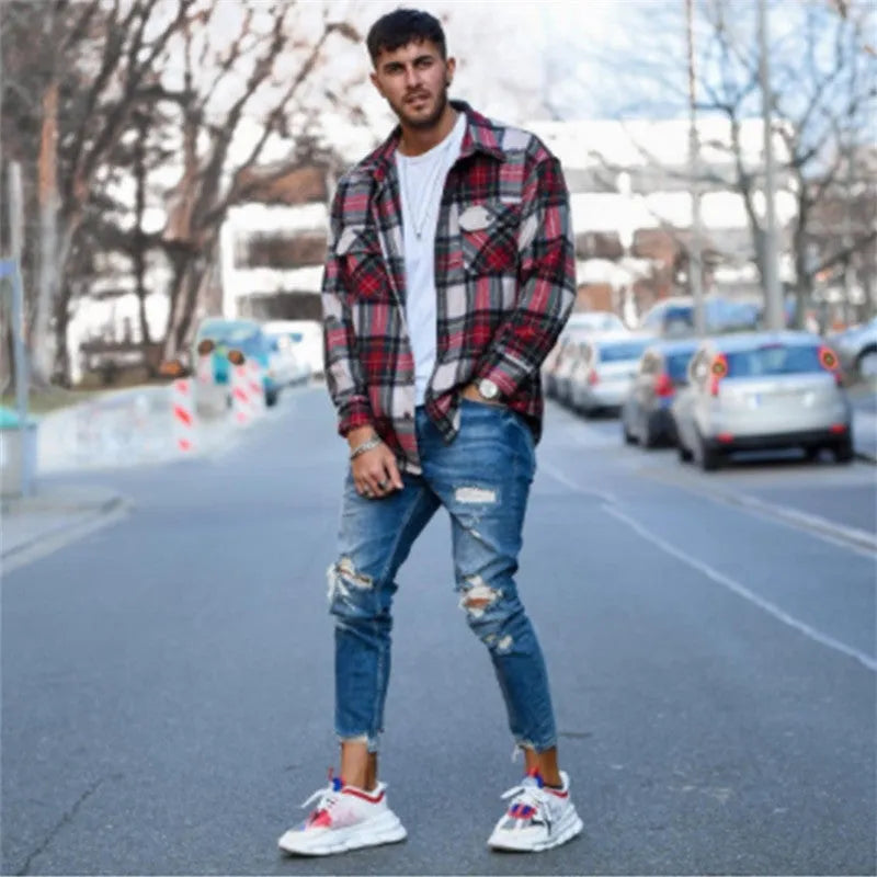 Men's deep blue jeans with knee hole distressed detailing on cotton fabric