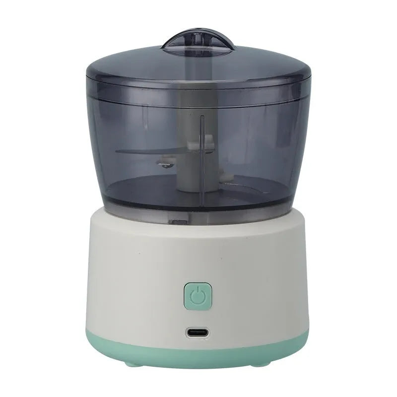 White and light green mini electric meat grinder with transparent cup and stainless steel blades