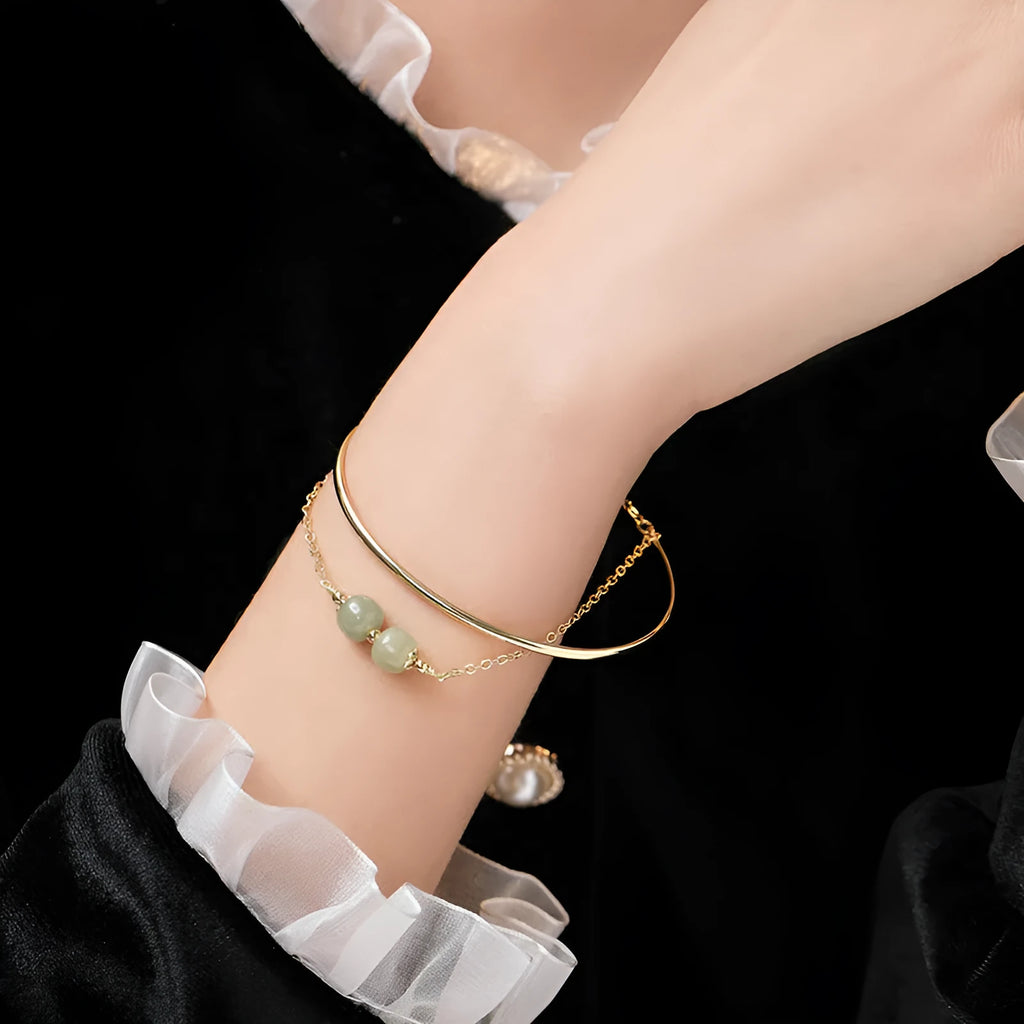 Women's Hetian jade lucky beads bracelet with gold inlay in single, double, and three-bead versions.