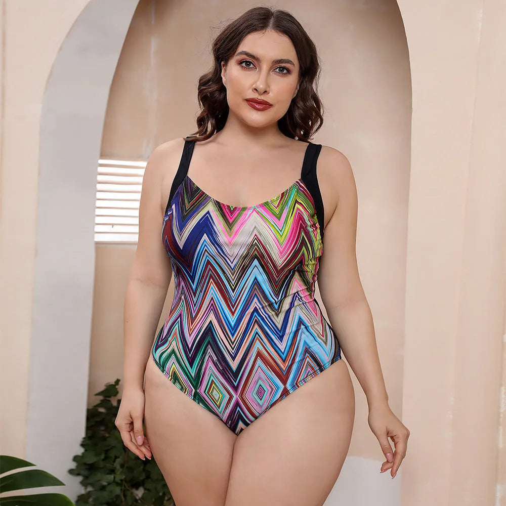 Women's vest style one-piece floral print swimsuit with spaghetti straps on a mannequin.