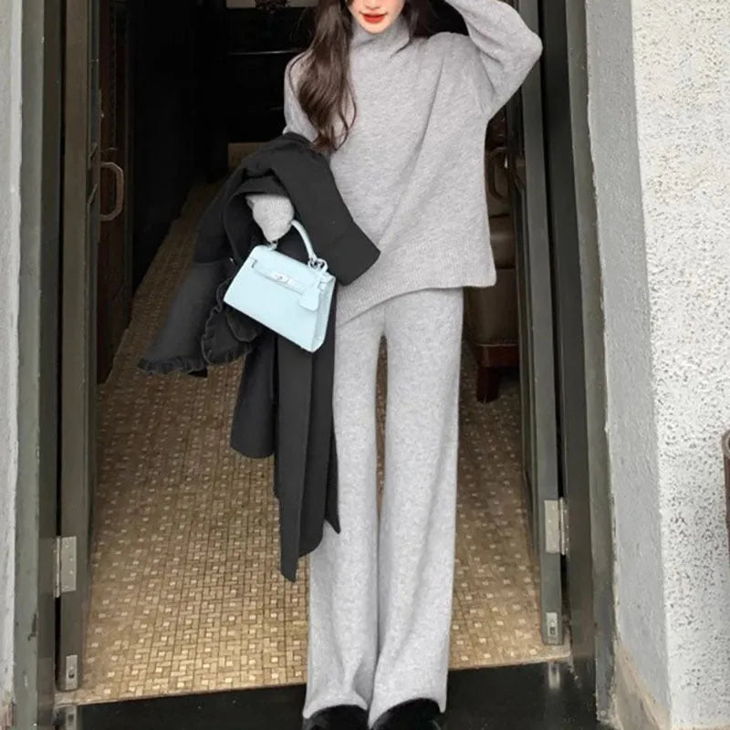 Women's casual two-piece set featuring a long sleeve sweater and wide leg trousers in a solid colour.