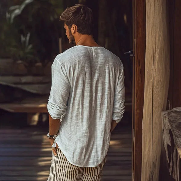 Beige slim fit long sleeve v-neck t-shirt laid flat, showing solid colour and fabric texture.
