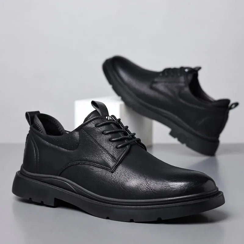 Men's black leather sneakers with decorative sewing lines and rubber sole shown in size 42