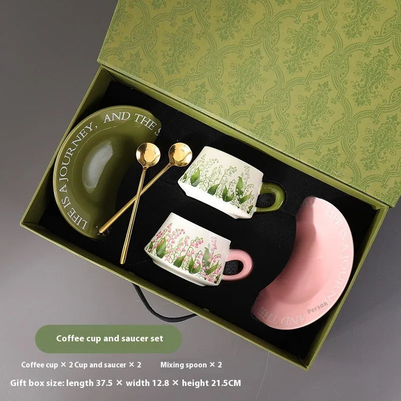 Ceramic coffee cup set with two 300ml cups, saucers and stirring spoons in decorative designs