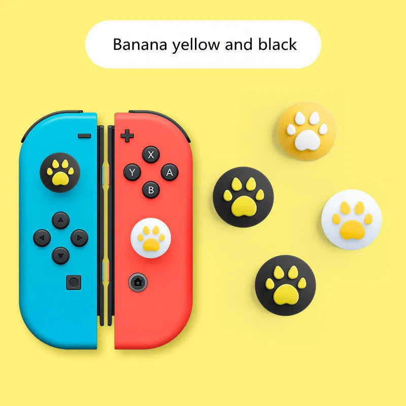 Four silicone rocker caps for Nintendo Switch Joy-Con controllers in assorted colours on a grey background.