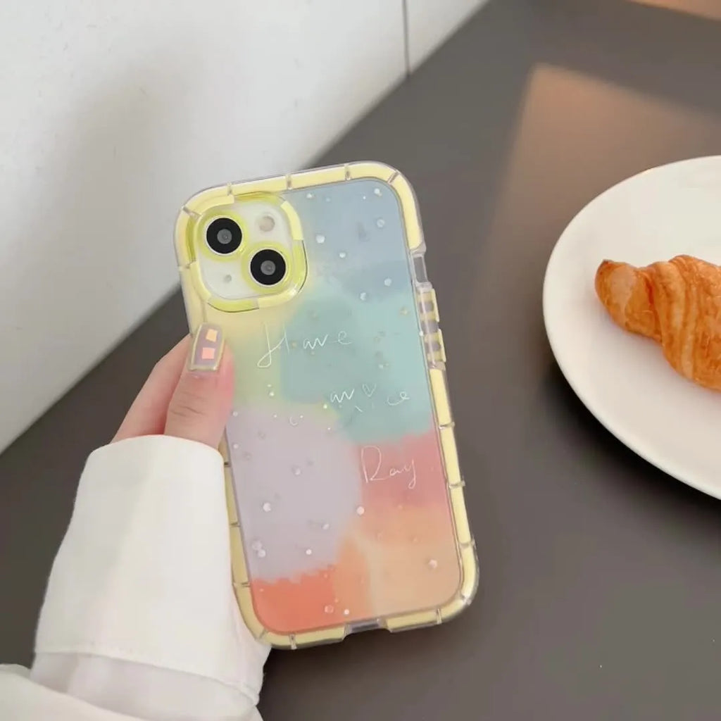 Minimalist yellow-edged silicone phone case for iPhone on a table, showing precise cut-outs for camera and ports.
