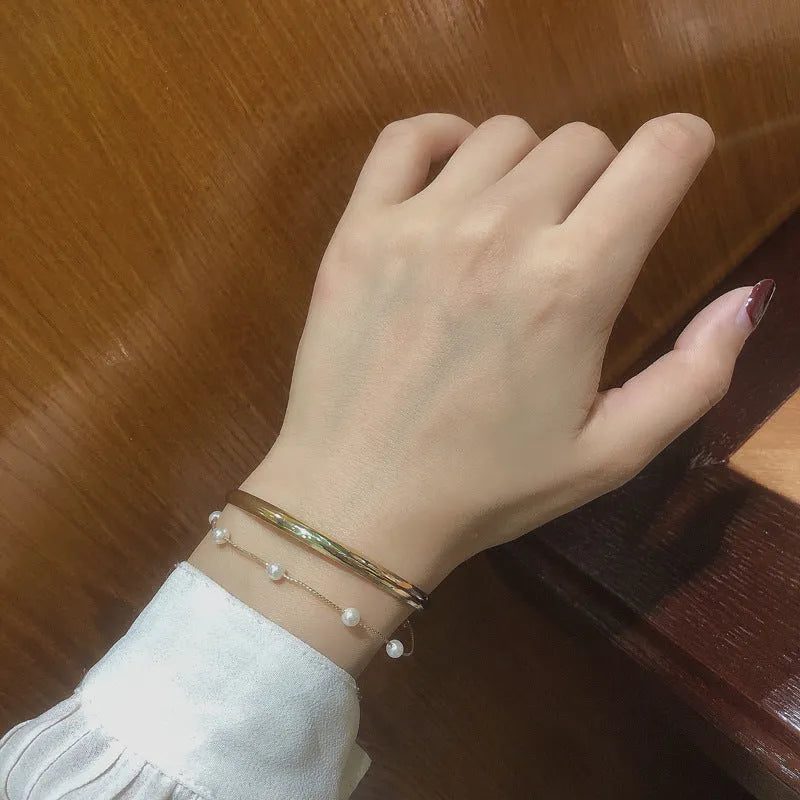 Double layered pearl coloured electroplating alloy bracelet, Korean style geometric design for women