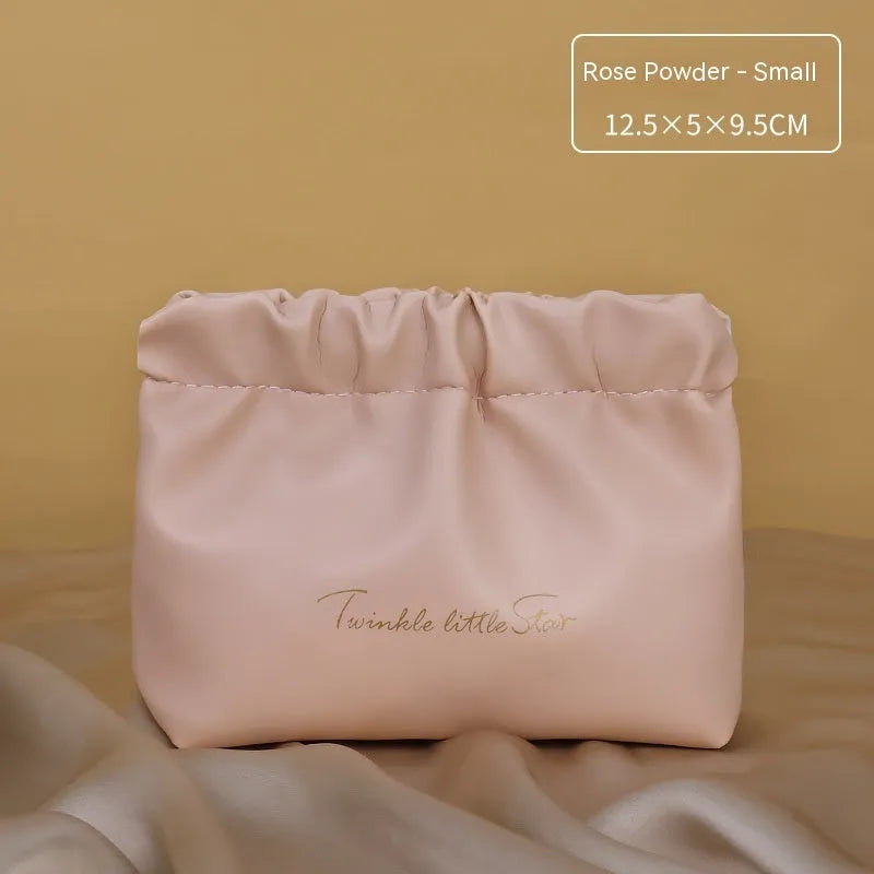 Leather travel toiletry bag in caramel mocha colour with large capacity and dry-wet separation compartments.