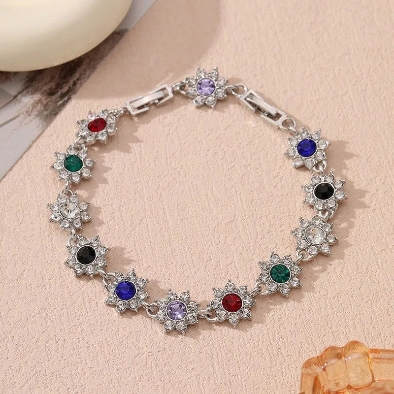 Gold and silver electroplated flower bracelet with coloured gemstone accents on zinc alloy