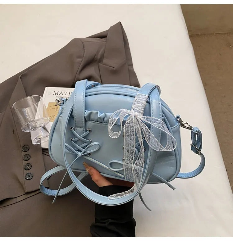 Women's casual PU shoulder handbag with a bandage bow and phone compartment in multiple colour options.