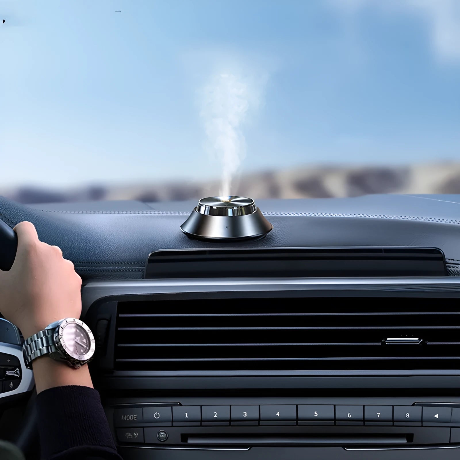 Black butterfly-shaped metal car aromatherapy air purifier with USB cable and essential oil bottle.