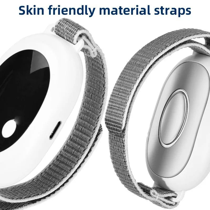 White sleep aid instrument with handheld remote control and wearable bracelet on a charging cable.
