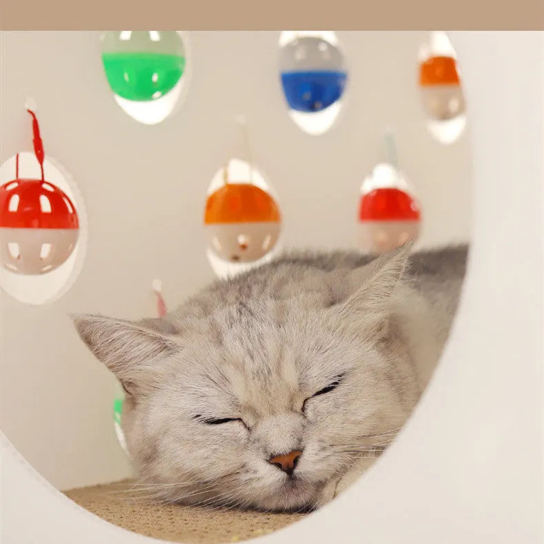Plastic cat scratch board integrated with cosy nest and tunnel containing bell ball