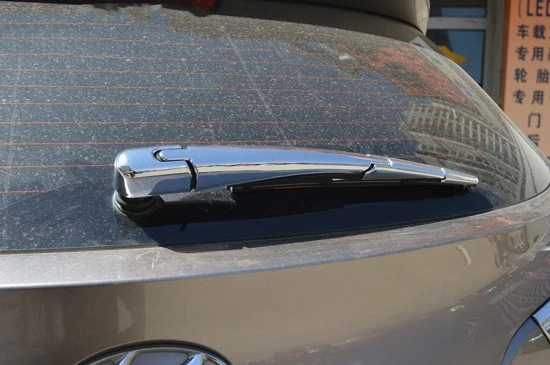 Set of four silvery ABS plastic rear window wiper cover trims for Hyundai 2010 model year vehicles.
