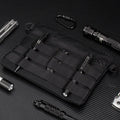 Black Oxford cloth outdoor organiser pouch with compact size for gear organisation.