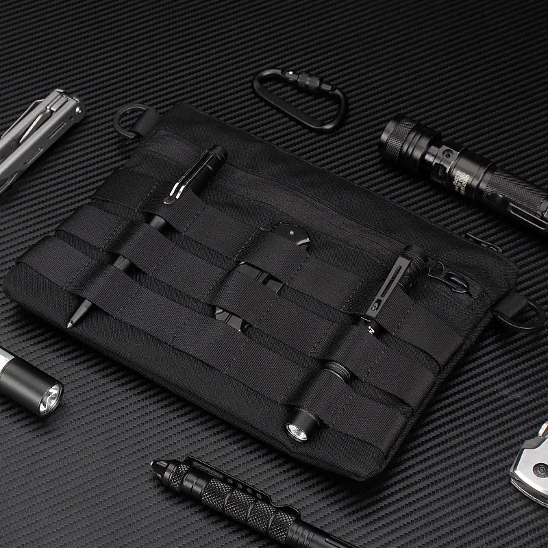 Black Oxford cloth outdoor organiser pouch with compact size for gear organisation.