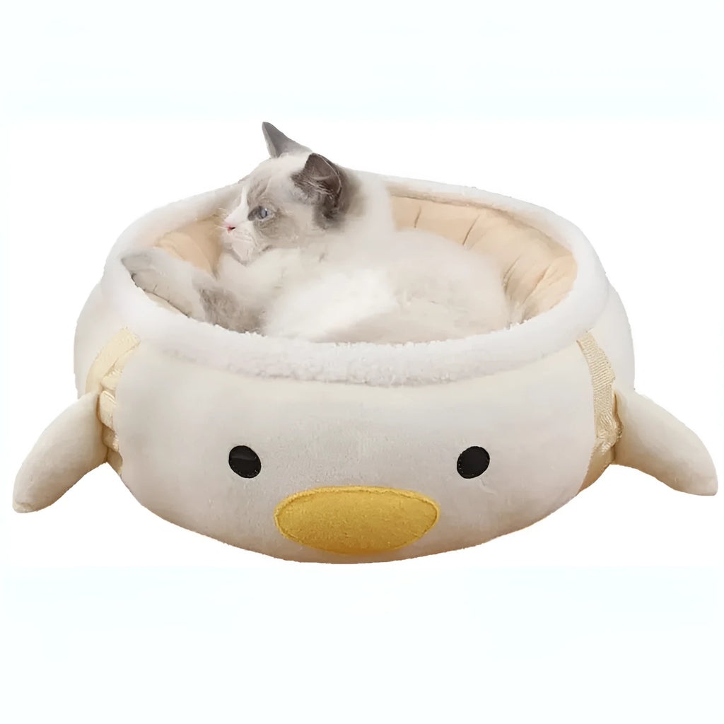Green dinosaur and chick-shaped cat bed shown both flat as a sofa and hanging as a hammock for small pets.