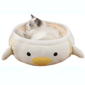 Green dinosaur and chick-shaped cat bed shown both flat as a sofa and hanging as a hammock for small pets.