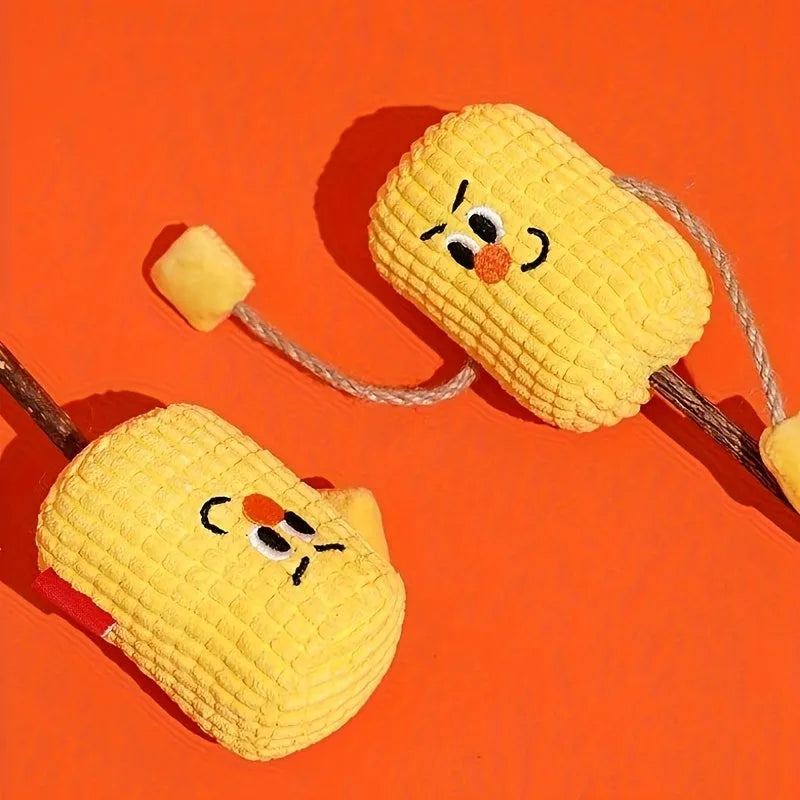 A corn cob shaped chew toy for cats made from polished beech wood, shown next to a tape measure indicating its 15cm length.