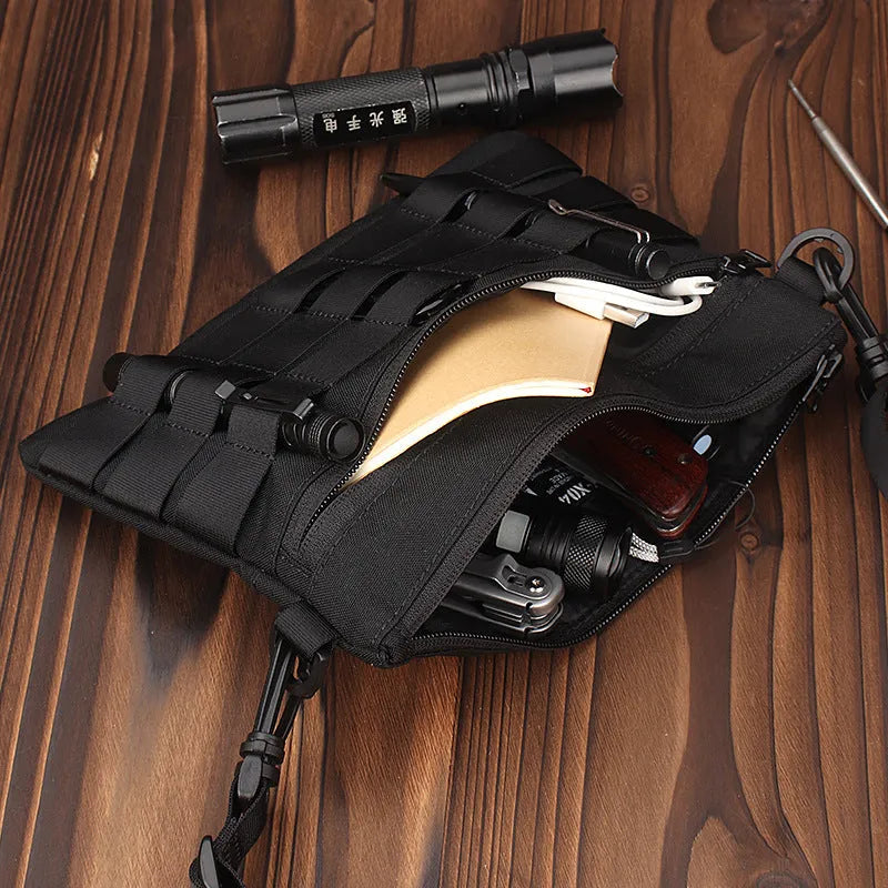 Black Oxford cloth outdoor organiser pouch with compact size for gear organisation.