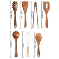 Seven-piece wooden kitchen utensil set showing spoons, spatulas and soup ladles arranged together