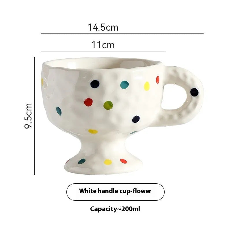 Handmade ceramic mug with irregular shape in solid colour