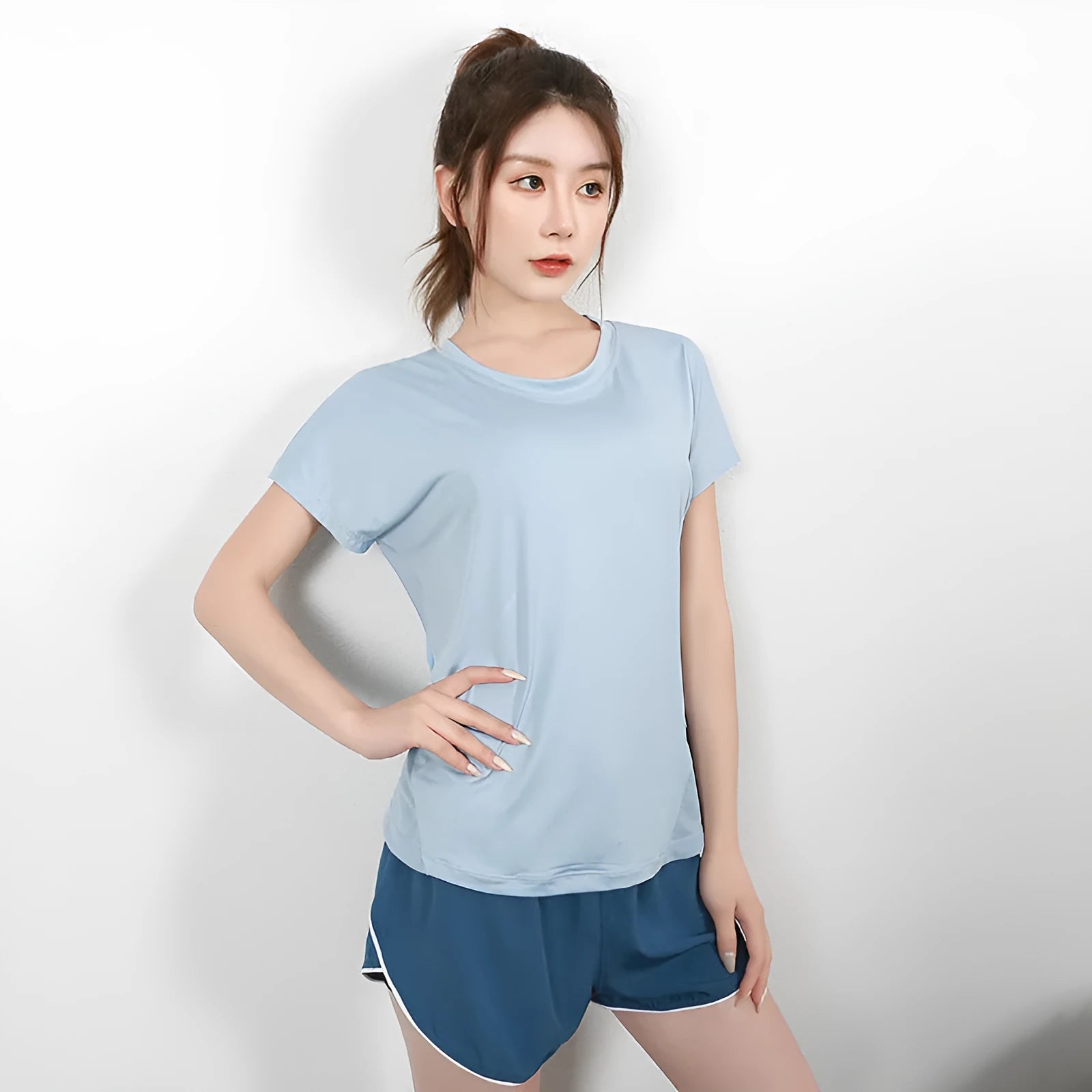 Women's short sleeve polyester sports t-shirt in sky blue, shown front view.