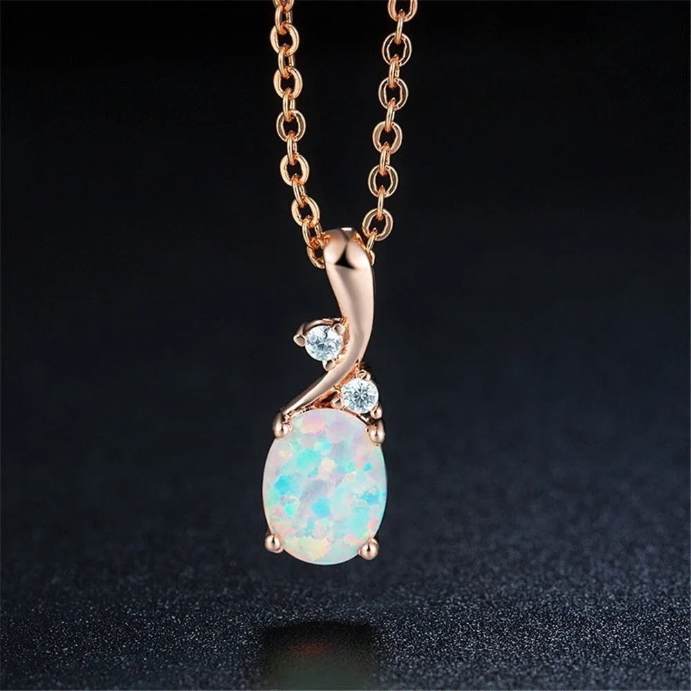 Water drop shaped opal pendant necklace with adjustable O-chain in rose gold or white electroplated finish.