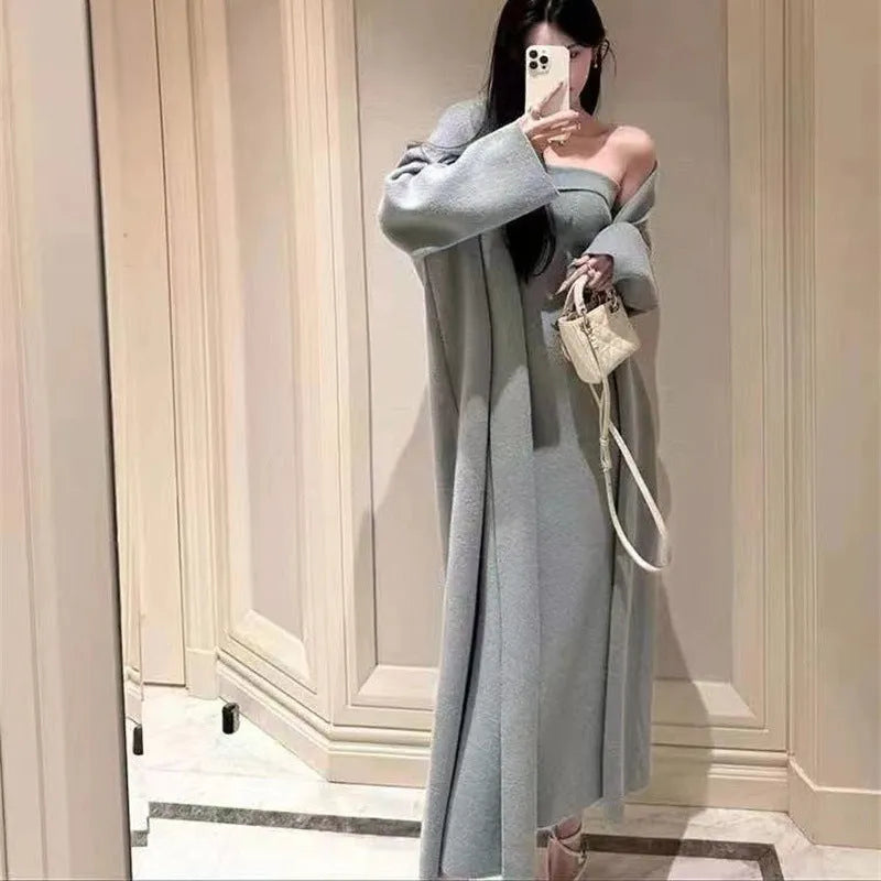 Women's grey knitted cardigan dress sweater suit two piece set with long skirt and regular sleeves.