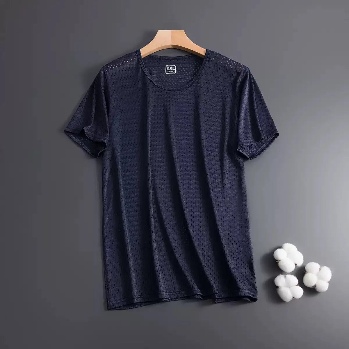 Man wearing ice silk short sleeve crew neck t-shirt in solid colour with thin mesh fabric